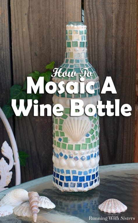 Learn how to make a mosaic wine bottle with shells and tiles! We'll show how to glue the tiles and mix the grout with a video and written steps! Wine Bottle Craft, Mosaic Bottles, Wine Bottle Ideas, Bottle Diy Crafts, Nautical Crafts, Wine Bottle Corks, Mosaic Art Projects, Wine Bottle Art, Wine Bottle Diy Crafts