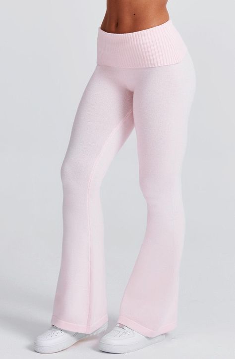 The Portia Knit Pants are a must-have for any wardrobe. These versatile pants feature a flattering fit and flare silhouette, with a wide rib waistband for added style. Complete the look with the matching Portia knit hoodie.     Colour: Pink.  Regular length.  Unlined.  Fit and flare silhouette.  Wide 2x2 rib waistband.  Fold over waistband detail.  Internal elastic in waistband.  Model is an XS and is wearing an XS.   Size: XS, S, M, L, XL, XXL Pants Folded At The Waist, Things For Wishlist, Pink Workout Pants, Waffle Pants Outfit, Pink Outfit Board, Pink Christmas List, Pink Boho Outfit, Shops To Buy Clothes, Cute Clothes To Buy