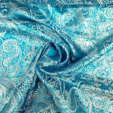 Metallic Paisley Brocade is 60" inches wide and 100% polyester. This fabric is available in 9 colors and sold by the yard. This wonderful brocade is perfect for your home decorations, apparel, table c Novelty Fabric, Fabric Suppliers, Oil Cloth, Brocade Fabric, Paisley Design, How To Dye Fabric, Paisley Pattern, Blue Turquoise, Baby Prints