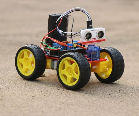 How to Make Obstacle Avoiding Car Using Arduino: Hey guys in this project I have made an Obstacle avoidance car that uses arduino, This robotic car will automatically avoid going in the path of any obstacles! How cool is that?  This robot car serves as an ultimate source of learning if you are will… Arduino Robot, Robotics Projects, Portable Tv, Electronics Mini Projects, Arduino Projects, Electronics Projects, Retro Gaming, Arduino, Electronics