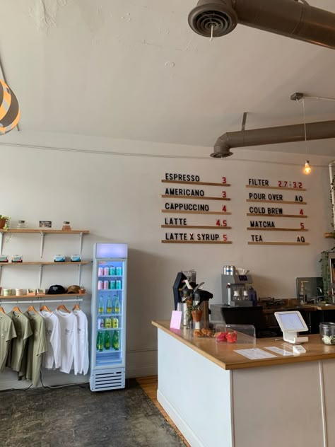 Cafe Organization Coffee Shop, Cafe Clothing Store, Coffee Shop Bar Ideas Cafe Design, Coffee Shop Renovation, Coffee Shop Employee Outfit, Coffee And Clothes Shop, Cafe Small Business, Coffee Shop And Clothing Store, Coffee Shop Merch Display