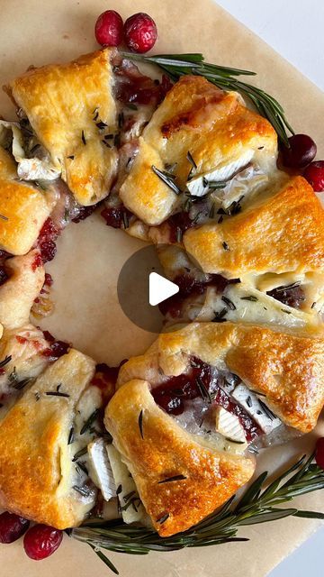 160K views · 8K likes | Ashley Lamego ♥ on Instagram: "Ep.6 Holiday Dinner Series : Easy Cranberry & Brie Wreath✨

1 package of original crescent dough 
1-2 cups of cranberry jelly (can substitute for any other jelly/jam you would like) 
1 brie 
1 egg 
Fresh Rosemary and cranberries for garnish 

Preheat oven to 375 F 
Place a small bowl upside down in the centre of your lined baking tray 
Place your crescent roll triangles overlapping around the bowl (pointy side pit) 
Spread cranberry jelly and top with pieces of baked Brie 
Fold in the crescent dough to form your wreath and remove the bowl 
Press the dough firmly around the wreath to ensure the pieces are connected 
Coat in egg wash and bake for 25-30 minutes (until golden brown). Allow to cool for 10 minutes 
Garnish with some chopped Cranberry Brie Christmas Wreath, Wreath Appetizer Crescents, Crescent Roll Brie Cranberry Wreath, Brie Cranberry Crescent Roll Wreath, Cranberry Crescent Baked Brie, Cranberry Brie Pastry Wreath, Cranberry And Brie Wreath, Brie Cranberry Wreath, Cresent Roll Brie Cranberry