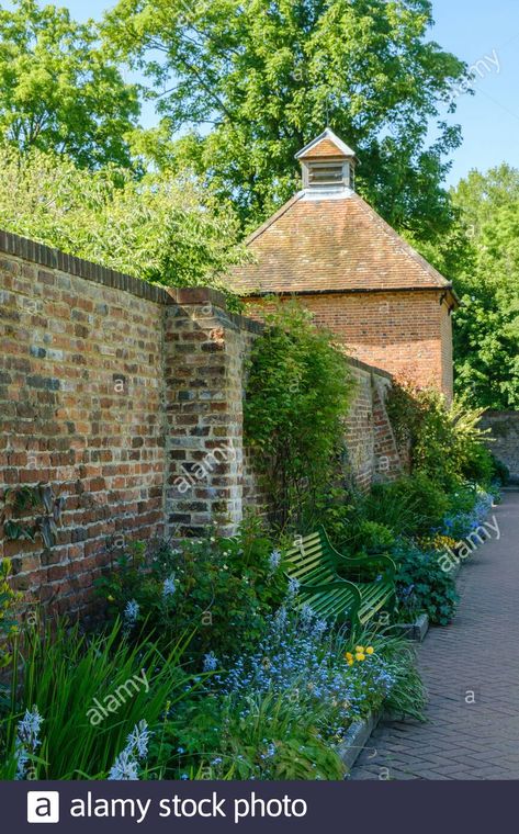 Empty park bench with flowers and old brick wall. Grade II listed 18th century Dovecote in the background. Eastcote Walled Garden, Hillingdon, London #JudiSaunders #PhotoArtTreasures #walledGarden #photography #London Old Brick Wall Garden, Bench With Flowers, Brick Wall Gardens, Welcome To London, Walled Gardens, Old Brick Wall, Brick Garden, Beautiful Parks, Healing Garden