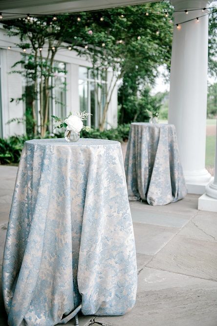 Blue Linen Tablecloth Wedding Reception, Blue Patterned Tablecloth Wedding, Blue And White Tablecloth Wedding, Blue Floral Linen Wedding, Blue And White Cocktail Table, Blue And Green Wedding Reception, Banquet Room Wedding Reception Ideas, Blue Green Silver Wedding, Sage Wedding Centerpieces Round Table