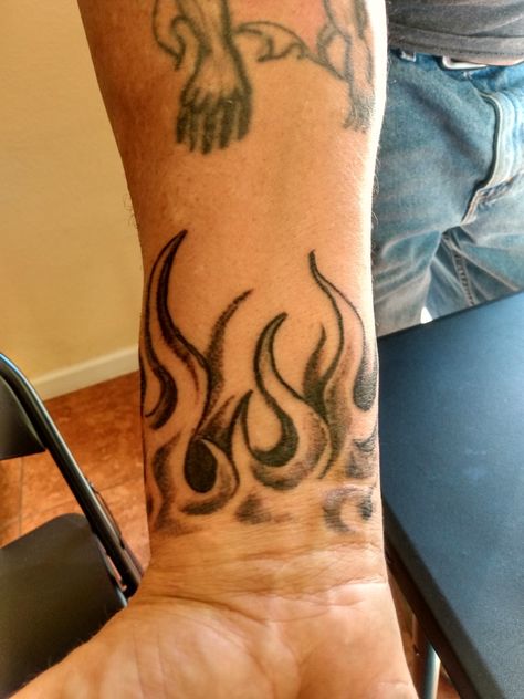 Fire Wrist Tattoos Men, Flames Drawing Tattoo, Neck Flame Tattoo, Red Ink Neck Tattoo Men, Filler Designs For Tattoos, Arm Filler Tattoo Ideas Men, Fire Wrist Tattoo, Flames Neck Tattoo, Flame Wrist Tattoo