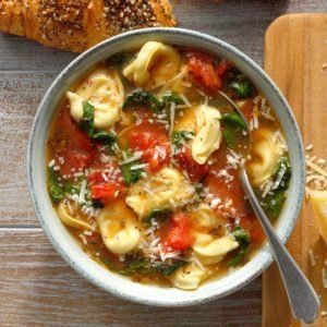 Christmas Tortellini & Spinach Soup Recipe: How to Make It | Taste of Home Rustic Italian Tortellini Soup Recipe, Rustic Italian Tortellini Soup, Italian Tortellini Soup, Garlic Tortellini, Italian Tortellini, Spinach Soup Recipe, Spinach Tortellini Soup, Sausage Tortellini Soup, Spinach Tortellini