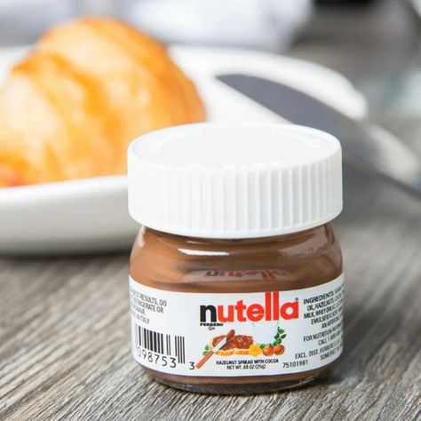 "Nutella lovers, rejoice! 😍 Indulge in the creamy, chocolaty goodness of the original Nutella Hazelnut Spread, now in adorable mini glass jars! 🥄 Perfect for on-the-go, sharing, or just adding a little sweetness to your day! 🌰🍫 Grab your case of 64 mini jars and turn snack time into a fun, delicious experience! #NutellaLove #MiniDelights" #conversationstarters Now available on Jodiabaazar.com. Nutella Label, Nutella Ingredients, Mini Nutella, Nutella Lover, Nutella Jar, Mini Glass Jars, Dessert Items, Nutella Spread, Chocolate Christmas