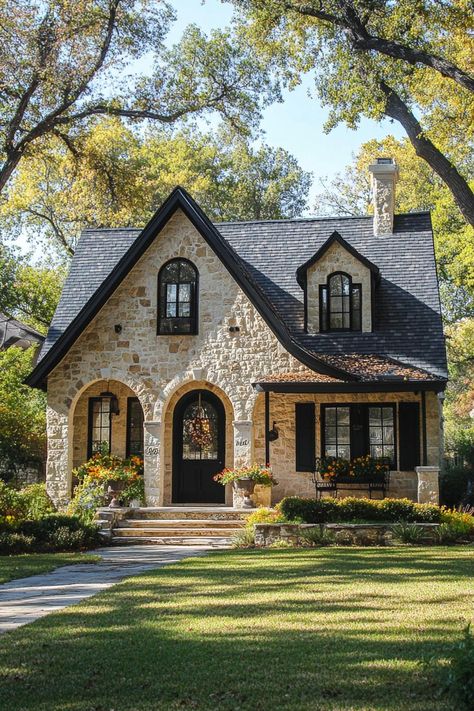 Stone cottage with arched entrance and lush garden. Ever find yourself daydreaming about the perfect house while scrolling through listings way out of your budget? You’re not alone. One Level English Cottage, Character Home Exterior, One Story House With Porch, Stone And Brick House Exterior Farmhouse, Stone Village House, Character Homes Exterior, Austin Stone House Exterior, Small Boho House Exterior, Single Level Home Exterior