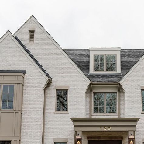 Oakley Home Builders on Instagram: "What’s a simple way to add a dose of character to an exterior? A flared detail on the sides of a gable roof is one element we often look to incorporate and it happens to be a fitting approach for both masonry and stucco." Gable Brick Detail, Exterior Gable Ideas, Gable Ideas Exterior, Garage Gable Ideas, White House Greige Trim Exterior, Off White Board And Batten Exterior, Amber Interiors Exterior, Stucco Siding Exterior Houses, Taupe Windows Exterior