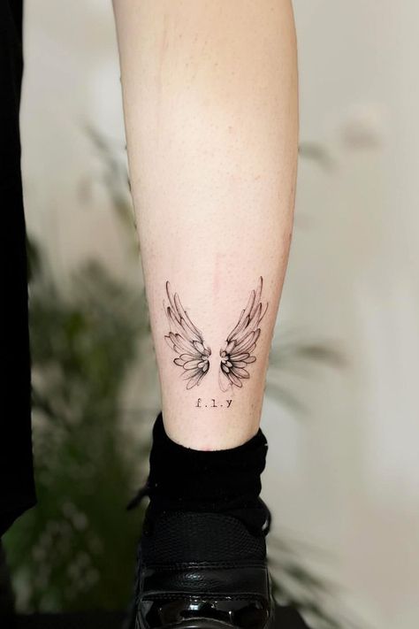 Unlock the symbolism of wings tattoos – a fusion of freedom, spirituality, and celestial beauty. Explore the allure now! #wingstattoo #wingstattoos #tattooart Wings Tattoo On Leg, Set Hairstyles, Person Tattoo, Wings Tattoos, Font Tato, Alas Tattoo, Gothic Tattoos, Tattoo On Leg, Freedom Tattoos