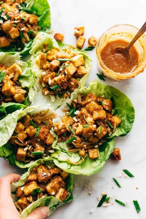 HELLO YUM. Firecracker Lettuce Wraps that are happily vegan - with crispy tofu bits, saucy brown rice noodles, and a creamy sesame sauce. #lettucewrap #vegan #tofu #veganlettucewrap #meatless #vegetarian | pinchofyum.com Tofu Lettuce Wraps Vegetarian, Tempeh Lettuce Wraps, Vegan Thai Lettuce Wraps, Pf Changs Tofu Lettuce Wraps, Crispy Wraps Recipes, Tofu Lettuce Wraps Pf Changs, Tofu Lunch Recipes, Lettuce Wraps Vegetarian, Meal Prep Tofu