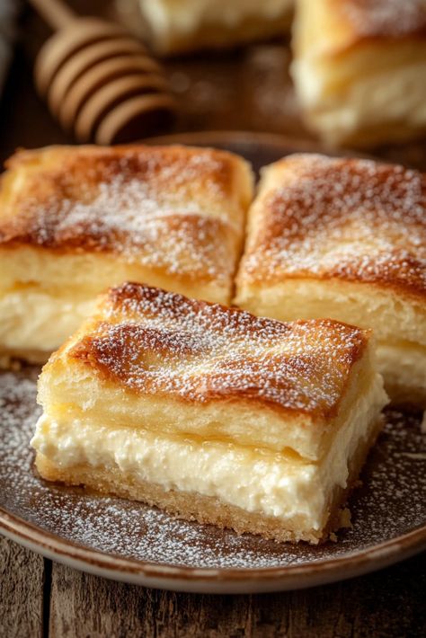 Crescent roll cheesecake bars topped with cinnamon sugar offer the delightful combination of rich, creamy cheesecake and crispy churros! This quick-to-assemble dessert is an ideal addition to any party. During a discussion about her daughter's graduation party menu, a friend introduced me to these unique cheesecake bars. Surprisingly, I had never encountered them before. She Dessert For Friends, Crescent Roll Cream Cheese Bars, Cinnamon Sugar Cheesecake Bars, Cinnamon Churro Cheesecake, Cinnamon Churro Cheesecake Bars, Churro Cheesecake Cake, Cinnamon Cream Cheese Bars, Cheesecake Bars 9x13, Good Snacks To Make