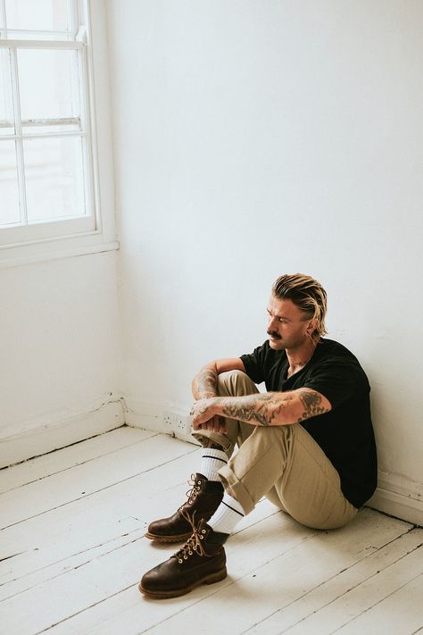 Alternative man sitting on a white wooden floor | premium image by rawpixel.com / Felix Man Sitting On The Floor Reference, Man Sitting On Floor Pose Reference, Person Sitting On Floor Reference, Guy Sitting Reference, Man Sitting On Floor, Floor Poses, Spotify Profile, White Wooden Floor, Men Posing