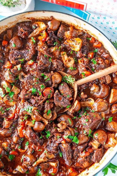 Impress your friends and family with Julia Child's world renowned Beef Bourguignon recipe that will make any get together unforgettable. This fork tender, fall apart beef simmered in a rich red wine flavored sauce is easier to make than you think and 100% worth the wait! From aberdeenskitchen.com Beef Bourguignon Recipe, Julia Childs, Wine Flavors, Chicken Dishes Easy, Party Dishes, French Cooking, Julia Child, Beef Dinner, Ready Meal