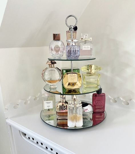 Using a 3 tier cake stand create a beautiful perfume display unit Ways To Display Perfume, Cake Stand Perfume Display, Perfume Tier Tray, Perfume Dresser Display, Fragrance Display Stand, Bedroom Perfume Display, Parfume Displays, How To Display Perfumes, Perfume Stand Ideas