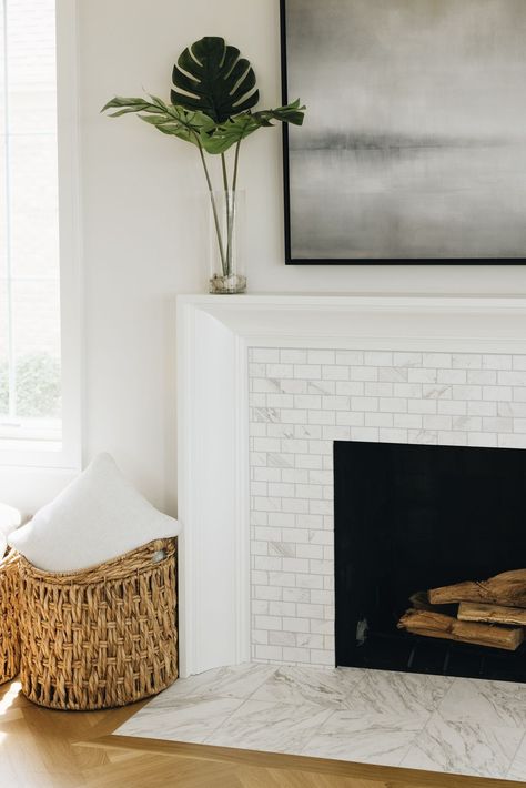 Design by Timber Trails.​ Photo by Stoffer Photography.​​ Tile featured: Volakas Honed Marble Amalfi + 12x12in. Fireplace Feature Wall, Inset Fireplace, Fireplace Tile Surround, White Fireplace, The Tile Shop, Fireplace Remodel, Living Room Spaces, Fireplace Tile, Marble Tile