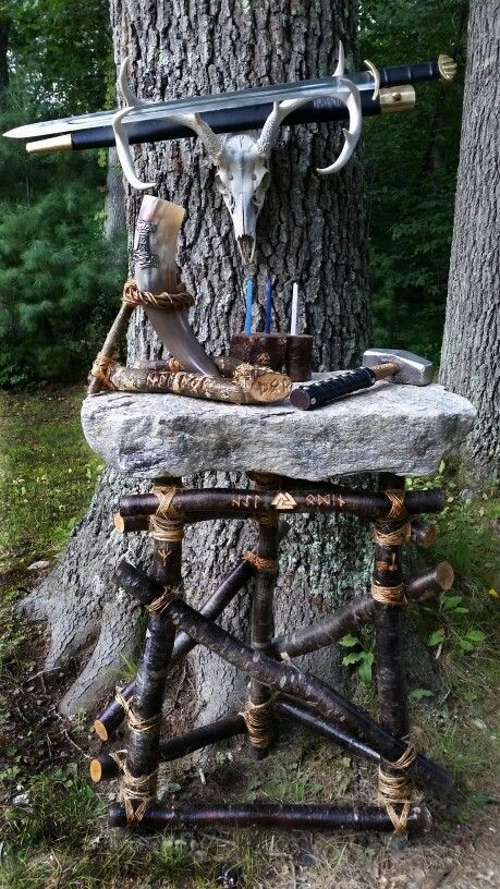 Odinist Ritual Area - 5...Odinist altar prepared for a general ritual. The granite slab rests on a wooden framework I made; the upper horizontal bar is engraved with the Runes, "Hail Odin" and Valknut, the left upright with the Elhaz Rune, the right with the Mjolnir Rune. The Trinkhorn with Thor's Hammer symbol rests in a wooden stand, engraved with the Runes, "Hail Thor," and "Thor." A wooden candle-holder/incense-holder is engraved with the powerful Triskelion Rune. Mjolnir is at the right on Norse Paganism Altar, Norse Pagan Alter, Norse Pagan Altar Inspiration, Lokean Altar, Thor Altar, Slavic Altar, Asatru Altar, Viking Altar, Elhaz Rune