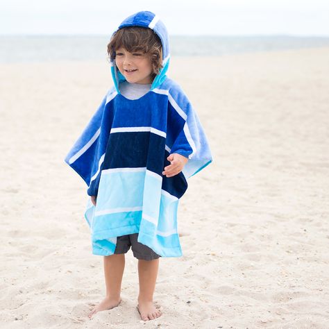 Looking for the perfect cover up? Learn How to Sew a Kids Beach Towel Poncho! On a recent trip to a local surf store, I saw that they were selling these cute beach towel ponchos for kids. They were close to $60, so naturally I thought “Hey, I can make that!” These ponchos are the perfect way for kids to dry off and stay warm. Best of all, they’re so easy to make! This project requires no store-bought sewing pattern and start to finish it took me about 15 minutes. Happy sewing! Looking for more E Beach Towel Poncho, Poncho Diy, Beach Coverup Pattern, Hooded Beach Towel, Surf Store, Towel Poncho, Kids Beach Towel, Beach Poncho, Kids Hooded Towels