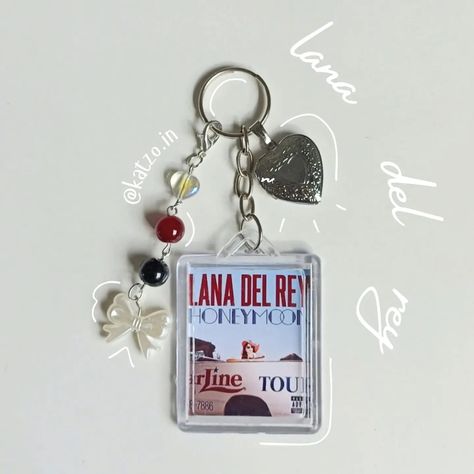 LDR photocard keychain 🎀 price range: ₹320- 310 we're open for customs!! dm to purchase or shop via website 🎀 . #viral #trending #jewelleryindia #jewellery #handmadejewellery #hellokitty #sanrio #jewellerydesigner #jewellerymaker #jewellerylover #explore Photocard Keychain, Lana Del Re, We're Open, Crochet Clothing And Accessories, Price Range, Custom Keychain, Dream Jewelry, Phone Charm, Jewelry Maker