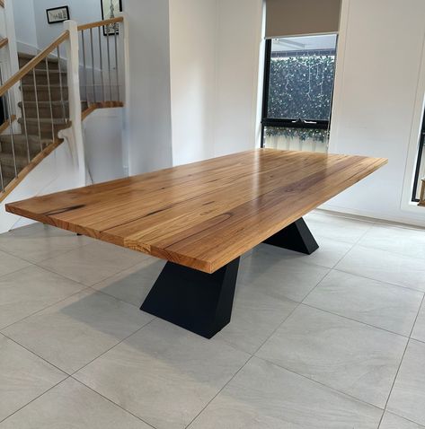 This stunning Monaco dining table features a beautifully crafted solid timber top with striking natural grain patterns. The table is elevated by premium-quality legs made from 10mm solid steel plate, giving it both an industrial edge and unmatched durability. The sleek, black powder-coated finish of the legs perfectly complements the warmth of the timber, creating a bold yet timeless piece that stands as a centerpiece in any modern space. https://lumberfurniture.com.au/products/monaco-di... Recycled Timber Furniture, Timber Dining Table, Timber Vanity, Timber Shelves, Live Edge Dining Table, Timber Furniture, American Black Walnut, Metal Dining Table, Contemporary Furniture Design