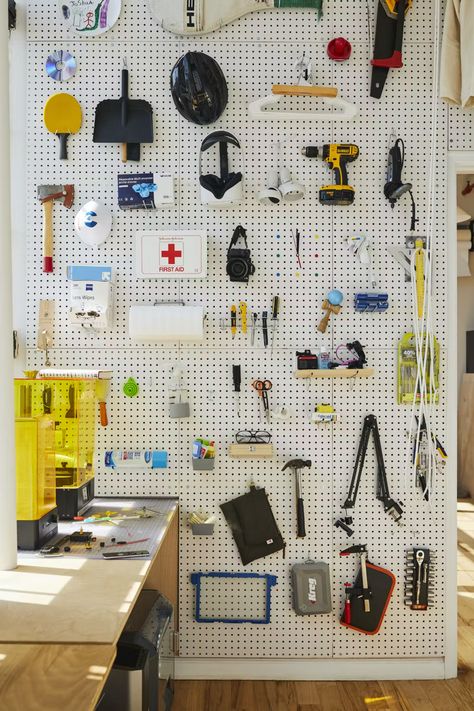 Photo 8 of 32 in 18 Smart, Space-Saving Interiors in Tiny Homes and Apartments - Dwell Studio Pegboard, Adaptable Architecture, Plywood Desk, Pegboard Wall, Office Organization Ideas, Gear Room, Office Vibes, Live Work Space, Clutter Control