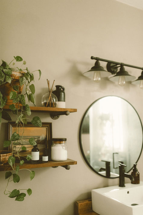 I don’t think I’ll ever get tired of floating shelves in a bathroom. They are functional for some extra bathroom storage and for all the pretty things. Mine are filled with my everlasting candle, Epsom salts, plants, and my favorite non-toxic skincare. Who doesn't love a good plant shelf, right? Bathroom Shelf With Plants, Functional Bathroom Shelves, Decorating Open Shelves In Bathroom, Small Bathroom Shelves Over Toilet Ideas, Shower Shelves Aesthetic, Bathroom Plant Shelves, Floating Shelf Bathroom Decor, Bathroom Floating Shelves Decor Ideas, Floating Shelves And Mirror