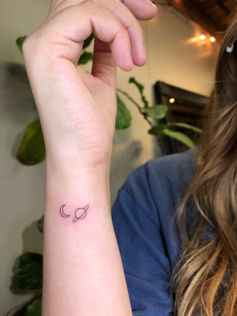 Taylor swift tattoo, moon and saturn tattoo, planets tattoo, tiny tattoo, simple tattoo, wrist tattoo Simple Moon And Saturn Tattoo, Simple Taylor Swift Tattoo Ideas, Planet And Moon Tattoo, Small Moon And Saturn Tattoo, Saturn Tiny Tattoo, Last Kiss Tattoo Taylor Swift, Taylor Tattoos Ideas, Tattoo Ideas Aesthetic Simple, Taylor Swift Wrist Tattoo