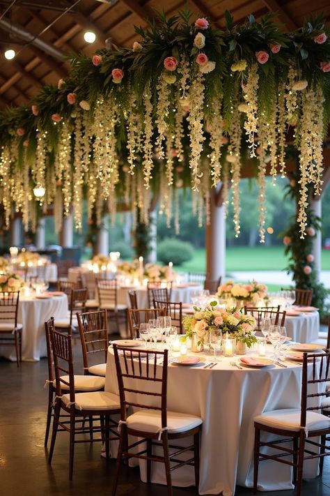 Elegant wedding reception with floral ceiling decor. Unlock a secret garden of enchanting wedding decor ideas that promise to transform your venue into a dreamy, botanical paradise. Magical Garden Wedding Theme, Wedding Decor Ceiling Ideas, Enchanted Garden Reception, Indoor Garden Wedding Reception Decor, Flowers On Ceiling Wedding, Twinkle Lights Wedding Reception Indoor, Botanic Wedding Theme, Ballroom Garden Wedding, Whimsical Wedding Reception Decor