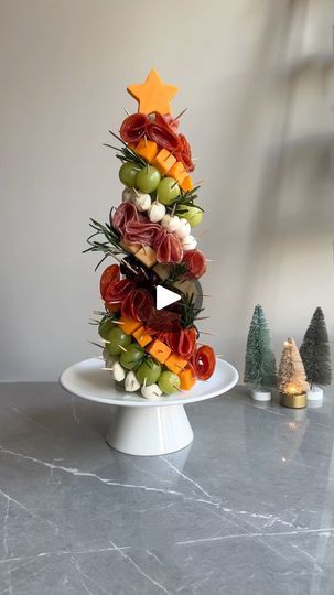 146K views · 3.6K reactions | Holiday Recipe Countdown – 37 Days Until Christmas! 🎄✨

Your holiday table isn’t complete without this ASMR CharcuTree 🌲🧀! It’s stunning, easy to make, and guaranteed to steal the spotlight at every gathering.

Here’s how to make it:
🎄 Wrap a styrofoam cone in cling wrap (size depends on your crowd).
🎄 Cube 2 cheeses—I used Gouda + orange cheddar.
🎄 Prep fruits, veggies, and pitted olives ahead of time.
🎄 Fold salami slices for a fuller look.
🎄 Fill gaps with rosemary sprigs for that tree effect.
🎄 Top with a cheese star using a cookie cutter!

Want your guests to be obsessed with your holiday spread? Save this post, tag someone who needs to make this Charcuterie Tree

#christmasrecipes #christmasrecipe #christmascharcuterie #charcuterieboard #festive Christmas Tree Charcuterie Cone, Charcuterie Tree Christmas, Charcuterie Tree Cone, Christmas Grazing Table, Charcuterie Tree, Cheese Stars, Christmas Party Tops, Christmas Appetizer Recipes, Christmas Appetizer