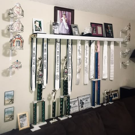 Pageant Crown and Sash Display using shelf brackets Pageant Crown And Sash Display, Pageant Sash Display, Dance Awards Display Ideas, Crown And Sash Display, Pageant Room, Medal And Trophy Display, Crown Display Ideas, Pageant Crown Display, Pageant Crown Display Ideas