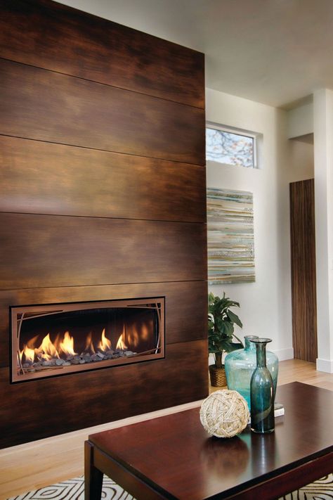 Light Tone Wood Floor With Modern Wood Fireplace Modern Fireplace Inserts, Fireplace With Metal Surround, Entryway Fireplace Ideas, Adhesive Fireplace Tile, Walnut Mantel Fireplace, Metal Fireplace Wall, Casual Family Room Design, Small Space Fireplace Ideas, Fireplace With Wood Paneling Wall