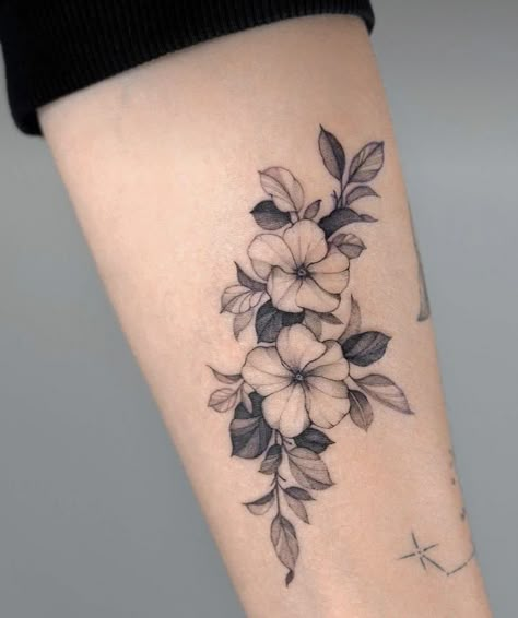 Love the varying light, medium, and dark shades of the leaves making the flowers pop in this example. Violet Flowers Tattoo, Tattoos Back Of Arm, Tattoo Wreath, Violet Tattoo Flower, Primrose Tattoo, Jasmine Flower Tattoo, Small Flower Tattoos For Women, Violet Flower Tattoo, Cover Up Tattoo Design