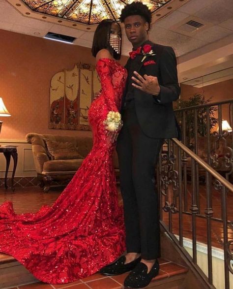 Red dress and black suits wore by a lovely young couple. Kindly visit our Facebook page for more fashion updates. Red Prom Couple Outfit, Red Prom Couple, Prom Couples Outfits, Matching Prom, Prom Couples, Prom Inspiration, African Prom Dresses, Prom Girl Dresses, Senior Prom Dresses