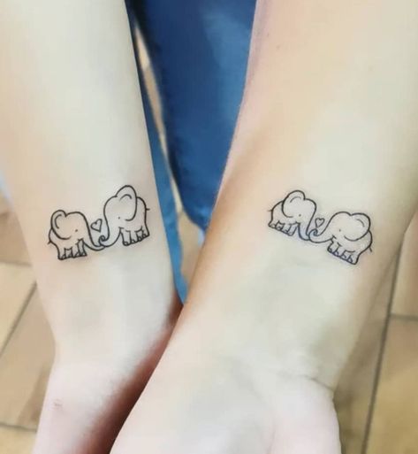 Simple Elephant Tattoos in Popular Styles for Inspiration | Inku Paw Elephant Tattoos Couple, Mother Daughter Otter Tattoos, Twin Elephant Tattoo, Mother Daughter Frog Tattoos, Mother Son Elephant Tattoo, Mom Daughter Tattoos Elephant, Mother And Daughter Elephant Tattoo, Elephant Sister Tattoo, Sister Elephant Tattoos