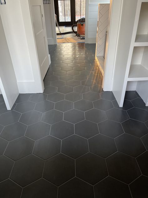 Black Honeycomb Tile Kitchen, Dark Hexagon Kitchen Floor, Honeycomb Tile Floor Bathroom, Black Honey Comb Tile, Powder Room Hexagon Tile Floor, Large Hexagon Tile Floor Bathroom, Honey Comb Flooring, Honey Comb Tile Floor, Black Hexagon Tile Entryway