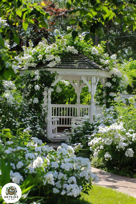 Transform your garden into an elegant escape with this stunning white gazebo. It's perfect for any occasion, from lazy afternoons to festive gatherings. Dive into more white garden beauty by tapping here! Hydrangea Garden Aesthetic, White Wooden House Exterior, Gazebo With Flowers, Garden Gazebo Aesthetic, Ethereal Garden Aesthetic, White Cottage Garden, Gazebo In Garden, White Gazebo Ideas Backyard, White Garden Aesthetic