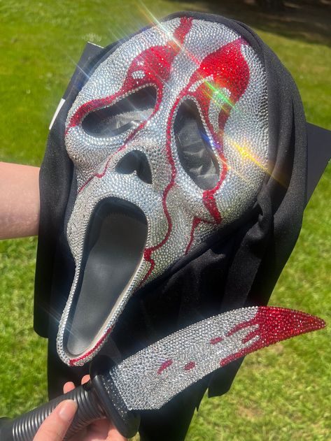 WILL BE OUT OF TOWN SEPTEMBER 9TH-24TH! I WILL SHIP EVERYTHING OUT AS SOON AS I CAN WHEN I GET BACK AND WILL KEEP YOU UPDATED ON YOUR ORDER! Handmade Bedazzled GhostFace Mask With Bedazzled Knife THIS IS MADE TO ORDER! Please wait 2-4 weeks for your order to ship out. I hand place almost 10,000 rhinestones on these items. I will also give plenty of updates and if you need it there sooner, please let me know. THERE IS A MINIMUM OF 7,000 RHINESTONES HAND APPLIED TO BOTH OF THESE COMBINED. The mask Bejeweled Scream Mask, Ghost Face Mask Rhinestone, Bedazzled Halloween Mask, Bedazzled Knife, Bedazzled Ghostface Mask, Rhinestone Ghostface Mask, Ghost Face Rhinestone, Horror Movie Masks, Ghostface Knife