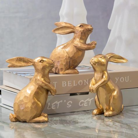 PRICES MAY VARY. Size: The gold rabbit figurines come as a set of 3. They are made of durable resin material with three different gestures. From left to right, the size of each item is about 4.1 inches in height and 1.7 inches in width, 2.9 inches in height and 1.7 inches in width, and 3.8 inches in height and 1.7 inches in width. Vintage Features: Exquisite and lovely bunny decor with antique finish in a vintage style, are a perfect choice for Easter theme decor and part of a spring centerpiece Statue Table, Gold Rabbit, Easter Bunny Figurines, Rabbit Statue, Bunny Statue, Ceramic Bunny, Rabbit Decor, Bunny Figurine, Rabbit Figurine