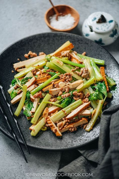 Dried tofu and celery stir fry is a satisfying and healthy main dish that you can put together in no time. The crunchy celery and chewy smoked tofu are cooked with a small amount of ground pork to enhance their flavor, along with ginger, garlic and soy sauce. It’s super easy to make and tastes very satisfying! {Gluten-Free Adaptable, Vegetarian Adaptable} Celery Stir Fry, Vegetarian Ham, Dried Tofu, Smoked Tofu, Vegetarian Oyster Sauce, Meat Replacement, Stir Fry Ingredients, Quick Stir Fry, Marinated Pork