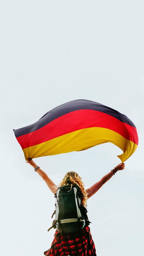 Download premium image of Woman holding the German flag by Jubjang about germany, adventure, background, backpack and backpacker 1214191 Gold Iphone Wallpaper, Flag Germany, Singapore Flag, German Study, Germany Football, German People, Germany Photography, Germany Flag, German Flag