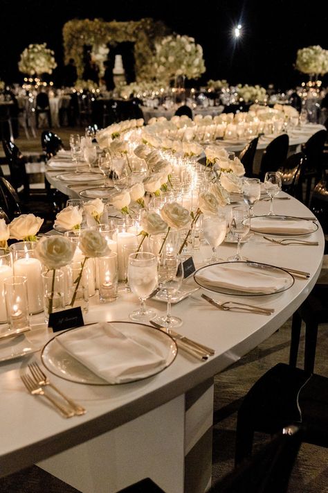 Curved wedding reception table decorated with white Roses and white candles. Head to the blog to see more of this black and white modern wedding in Austin! Curvy Table Wedding, Minimal Wedding Reception Table Settings, Modern Wedding Candles, Intimate Wedding Dinner Ideas, White Decor Wedding Receptions, White Roses Candles Wedding, Floral And Candle Table Decor, Wedding Reception Ideas Minimalist, Wedding Candles Reception