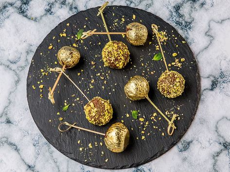 Gold Dipped Cherry Balls | So Delicious Gold Cherries On Cake, Gold Leaf Dessert, Edible Gold Desserts, Edible Gold Leaf Desserts, Cherry Balls, Dipped Cherries, Disco Ball Cherries, Dessert Styling, Colourful Food