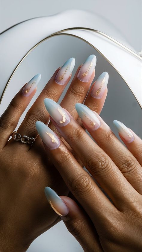 Elevate your nail art game with these stunning baby blue ombre nails, beautifully enhanced with glamorous golden elements! The soft gradient transitions from a tranquil blue to a delicate hue, while shimmering gold details add a touch of luxury and elegance. Perfect for special occasions or a night out, this manicure balances playful sophistication with a hint of shine. Style it with chic outfits and statement jewelry for an unforgettable look! ✨💙 #OmbreNails #GoldAccents #NailInspo Light Blue Gold Nails, Baby Blue And Gold Nails, Baby Blue Ombre Nails, Blue Gold Nails, Light Blue Nail, Light Blue Nail Designs, Blue Ombre Nails, Soft Gradient, Tranquil Blue