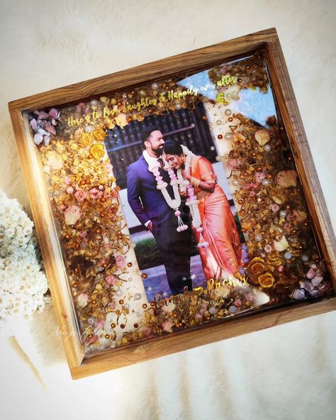 Hold onto the magic of your wedding with our elegant resin frames. Perfectly preserved for my client Rashvi ❤️ , it's a timeless keepsake of their love story ✨ Frame Details - 📍Teakwood Frame 📍12 x 12 inches size 📍Wall Hung DM @vinys_galleria_ to preserve your special memories into beautiful keepsakes 💝 Or call for enquiries 7008508244 (Handmade gifts, Resinframes, resin art, keepsakes, wedding gifts, wedding decorations, bride to be, couple gifts, small business, keepsakes gifts,... Wedding Resin Art, Love Story Frame, Resin Art Flower, Memories Frame, Varmala Preservation, Story Frame, Resin Photo Frame, Resin Photo, Handmade Small Business