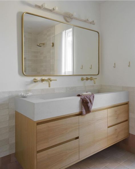 Audrey Crisp | Interiors on Instagram: “What an amazing bathroom makeover! I love the trough style sink and double brass wall mounted faucets! Gorgeous white oak vanity too!…” Trough Sink Bathroom Double, Tile 2023, Trough Sink Bathroom, Modern Bathroom Light Fixtures, What Is Interior Design, Mid Century Modern Bathroom, House Redesign, Light Fixtures Bathroom Vanity, Modern Bathroom Lighting