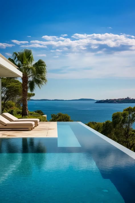 An infinity pool overlooking the sea Infinity Pool Mediterranean, Residential Infinity Pool, Infinity Swimming Pool Designs, Infinity Pool Backyard, Infinity Pool Design, Beach House Deck, Beach House With Pool, Pool Infinity, Beach House Pool