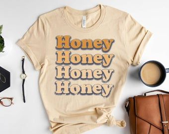 labsandlattes on Etsy 70s Tshirt, Boho Tshirt, Boho Tshirts, Groovy Shirt, 70s Clothing, Honey Design, Spring T Shirts, Oh Honey, Hippie Shirt