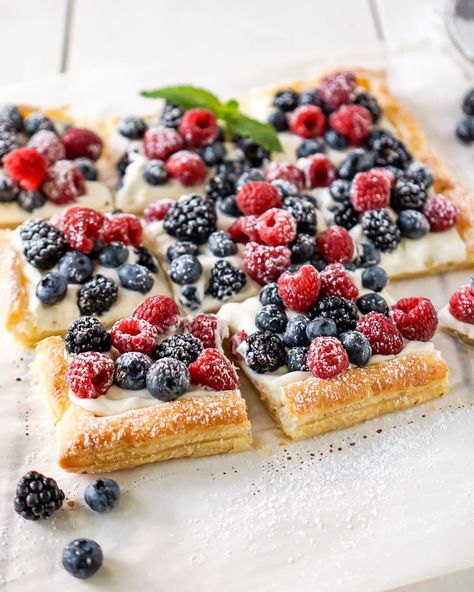 This simple berry cheese tart is a fun cross between a lazy man's tart and a cheesecake but it's made with puff pastry and fresh fruit. Breakfast Fruit Tart With Granola Crust, Puff Pastry And Berries, Puff Pastry Fruit Pizza, Fruit Tart Recipe Easy Puff Pastries, Puff Pastry Recipes Blueberries, Puff Pastry Recipes Breakfast Fruit, Fruit Tart Dessert, Puff Pastry Fruit Recipes, Easy Fruit Pastry