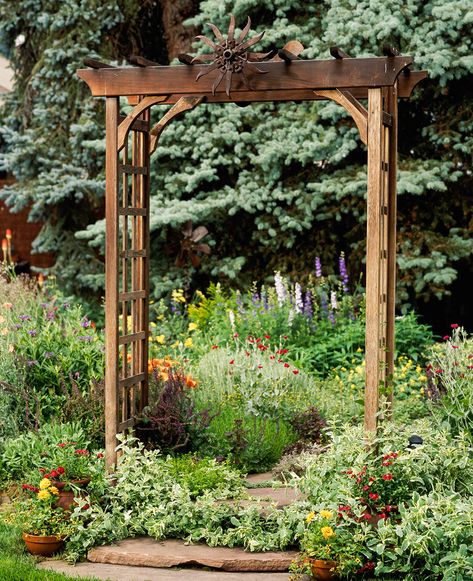 Whether standing alone or covered with climbing vines and flowers, these outdoor structures add a striking focal point to your yard. These arbor ideas will enhance your garden with charming appeal. #arborideas #pergolas #outdoorlandscaping #backyardideas #bhg Garden Arbor Ideas, Arbor Ideas, Wooden Arbor, Arbors Trellis, Side Yard Landscaping, Garden Arbor, Climbing Vines, Garden Theme, Perfect Garden