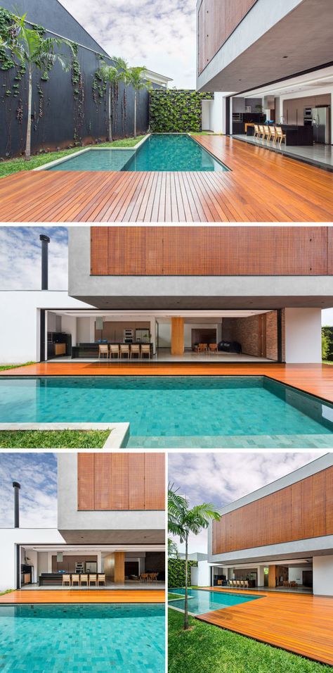 A large wooden deck wraps around this swimming pool that's located off the main living area of this Brazilian home. Pool Deck Design, Brazilian Home, Wooden Deck Designs, Deck Design Ideas, Moderne Pools, Wooden Deck, Swimming Pool House, Modern Pools, Small Pools